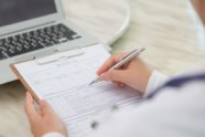 close-up-specialist-filling-out-form_1232-369-32400fc3